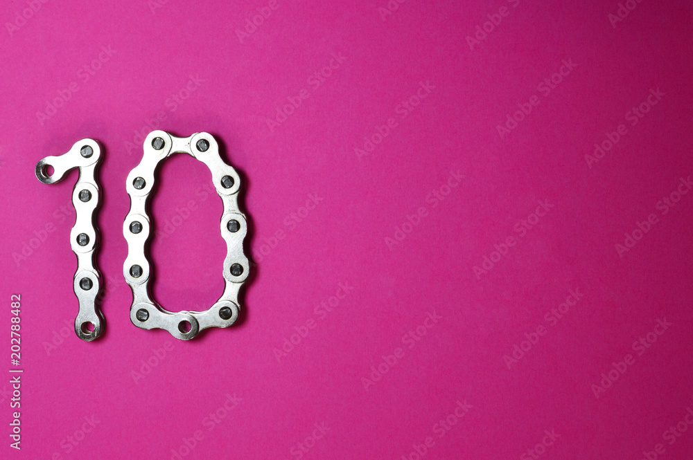 bike chain number ten on pink background bike chain number ten on pink background