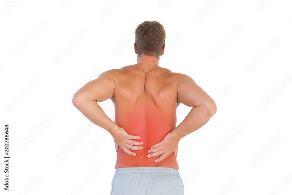 Shirtless man suffering from lower back pain on white background Shirtless man suffering from lower back pain on white background