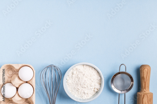 Ingredients for baking on a blue background.