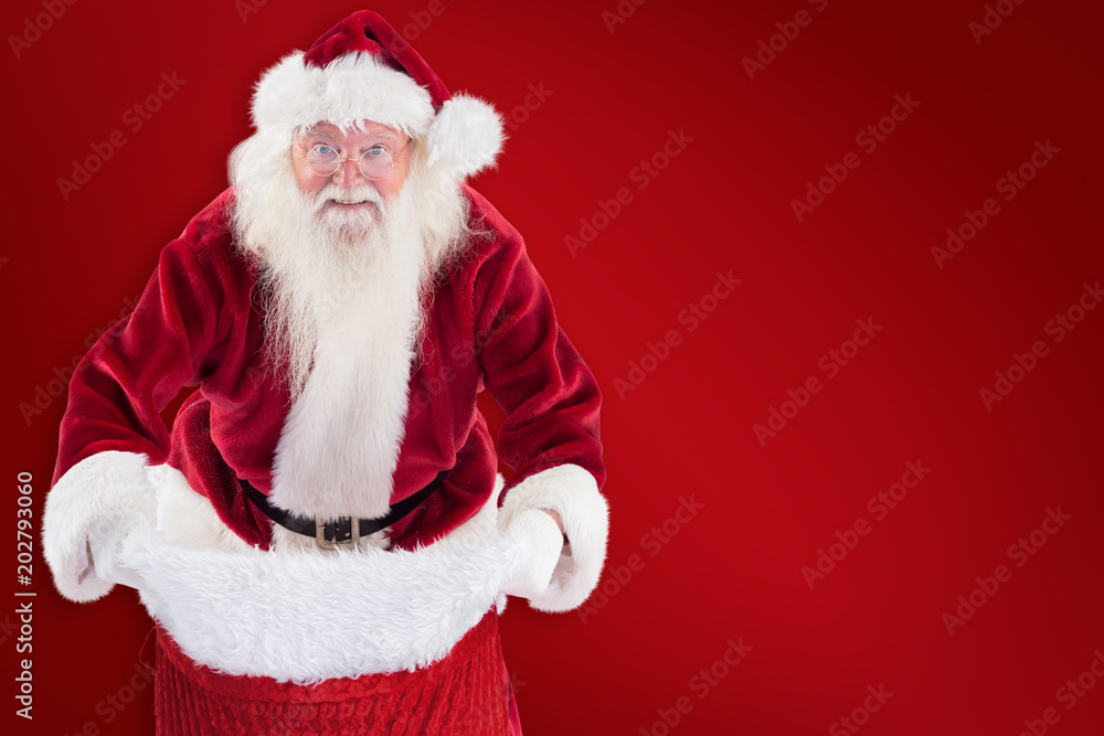Santa open his red bag against red background Santa open his red bag against red background