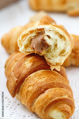Sweet croissant with caramel for breakfast