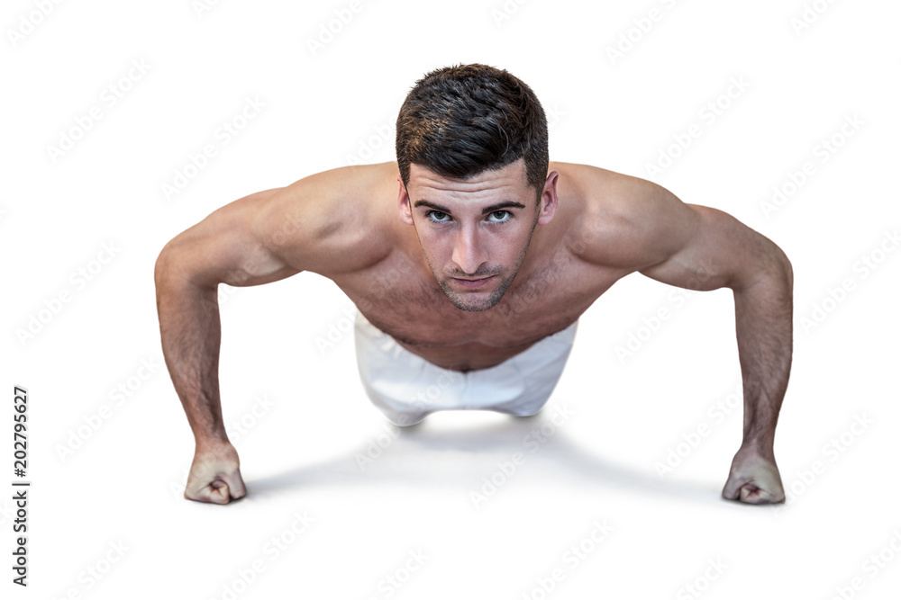 Man doing push up with clenched fist Man doing push up with clenched fist