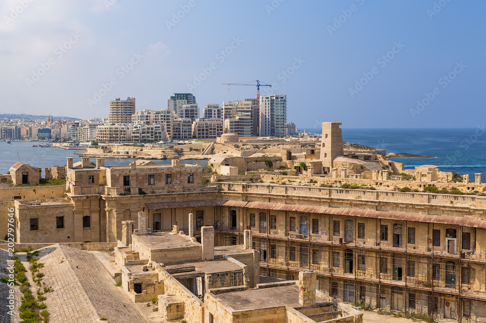 Valletta, Malta. View from inside Fort St. Elmo. In the background, on the other side of the bay of Marsamxette, Fort Tigne and the town of Sliema