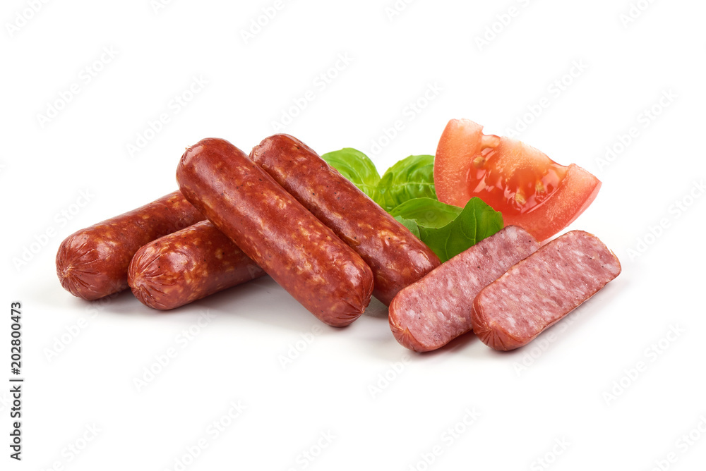 Salami smoked sausages with herbs and tomatoes isolated on white background Salami smoked sausages with herbs and tomatoes isolated on white background