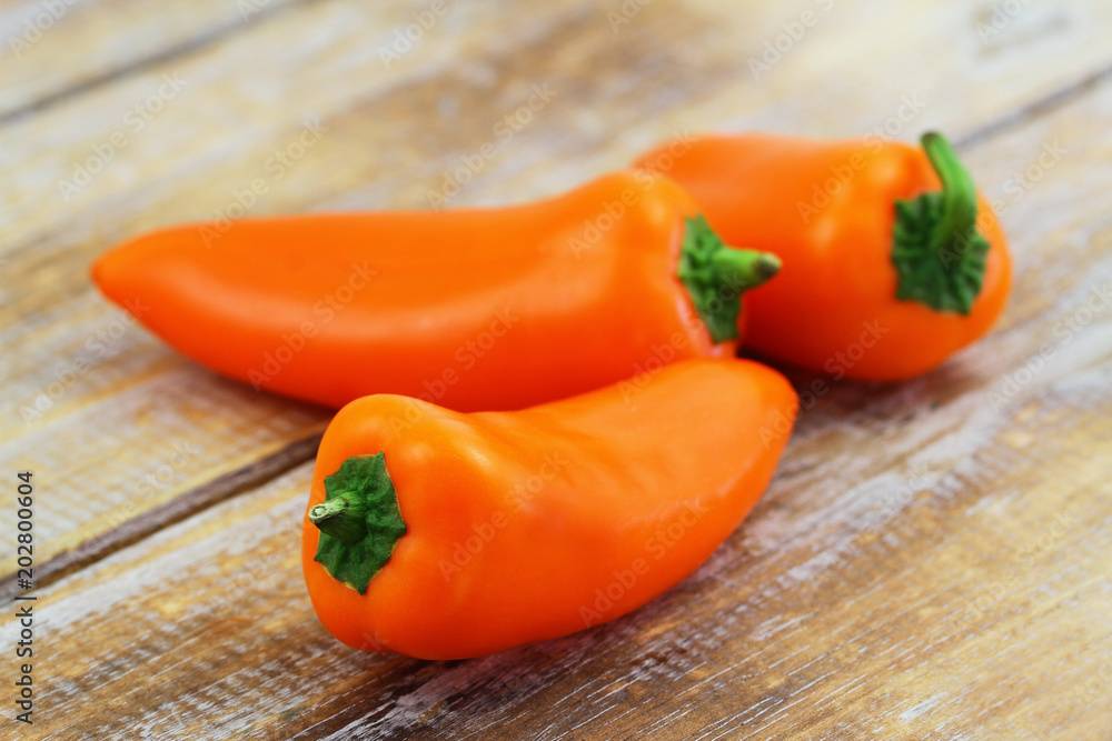Crunchy snack paprika on wooden surface, closeup
Crunchy snack paprika on wooden surface, closeup