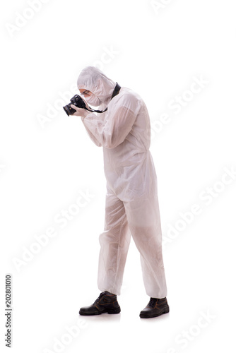 Forensic specialist in protective suit taking photos on white © Elnur