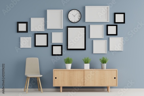 Blank group of  picture frame for insert text or image inside on wood table in living room.