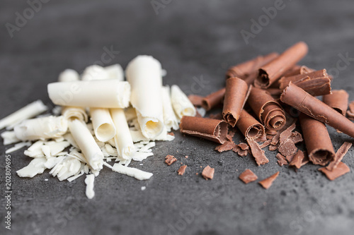 Delicious chocolate swilrs on rustic background photo