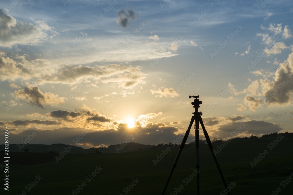 Silhouette of tripod during colorful sunset. Slovakia