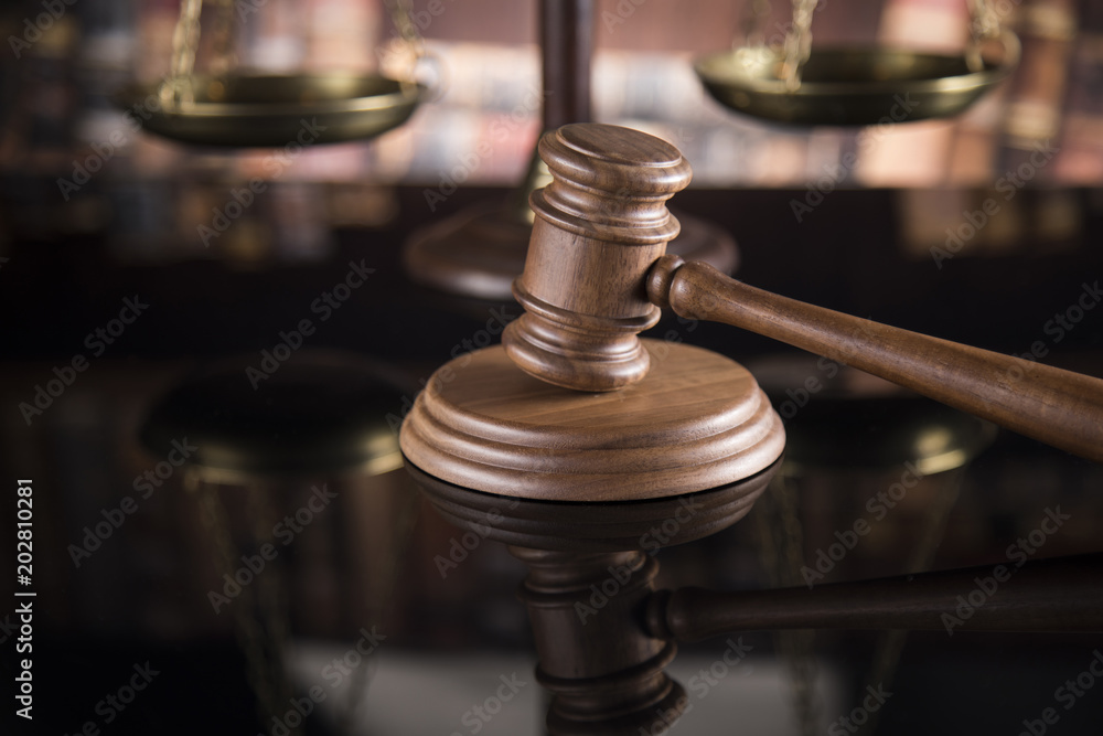 Law theme, mallet of judge, wooden gavel, mirror reflection background Law theme, mallet of judge, wooden gavel, mirror reflection background