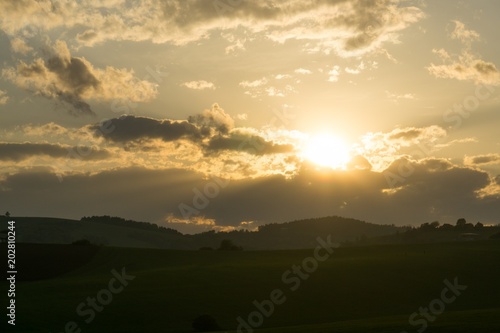 Sunset on meadow with hills and tree. Slovakia
