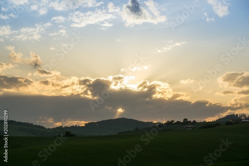 Sunset on meadow with hills and tree. Slovakia