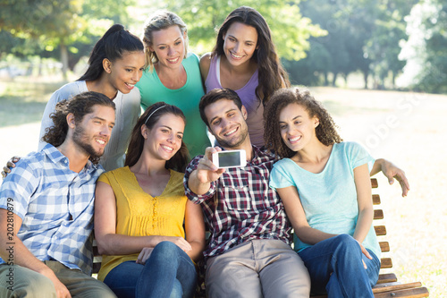 Smiling friends taking a selfie