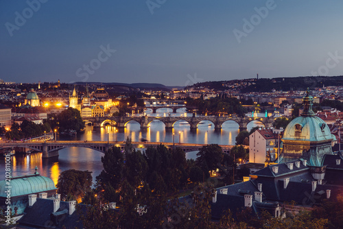 Beautiful view on Prague bridges from a hill. Sunset, evening view in Prague