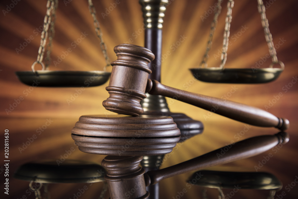 Law theme, mallet of judge, wooden gavel, mirror reflection background Law theme, mallet of judge, wooden gavel, mirror reflection background