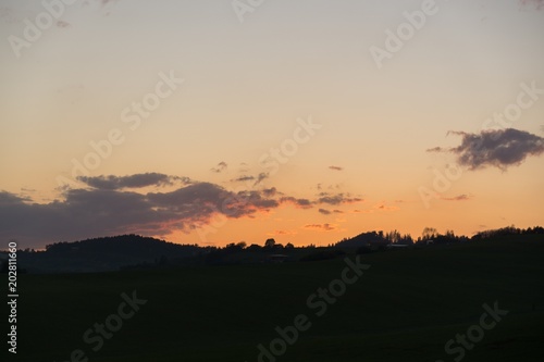 Sunset on meadow with hills and tree. Slovakia