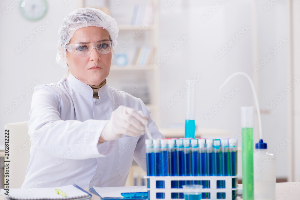 Woman chemist working in hospital clinic lab Woman chemist working in hospital clinic lab