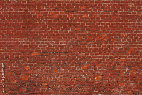 Old red brick wall - empty facade, retro background