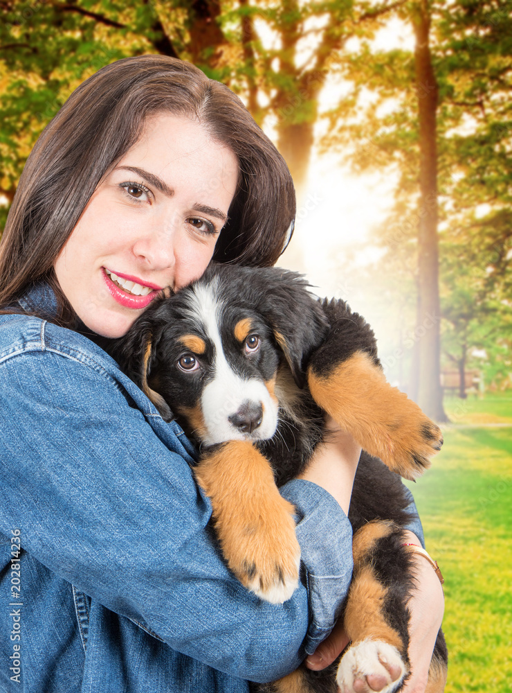 happy woman hige a puppy of bernese mountain dog happy woman hige a puppy of bernese mountain dog