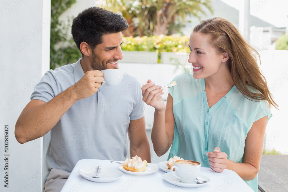 Portrait of a happy couple at coffee shop
