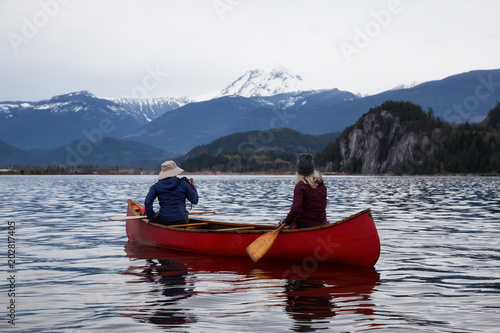 Adventurous people on a canoe are enjoying the beautiful Canadian Mountain Landscape. Taken in Squamish  North of Vancouver  British Columbia  Canada.