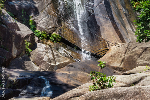 Fototapeta Naklejka Na Ścianę i Meble -  Seven wells waterfall in rocky mountains on tropical island Langkawi in Asia. Waterfall in Malaysia.