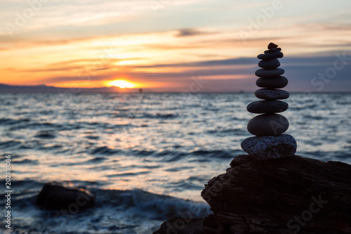 Stack of Rocks piled up by the ocean during a sunny sunset. Taken in Wreck Beach  Vancouver  British Columbia  Canada.