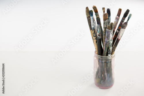 Various paintbrush in a jar