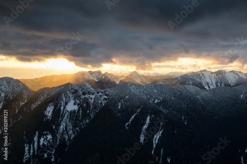 Aerial view of the beautiful Canadian Mountain Landscape during a vibrant cloudy day. Taken North of Vancouver, British Columbia, Canada.