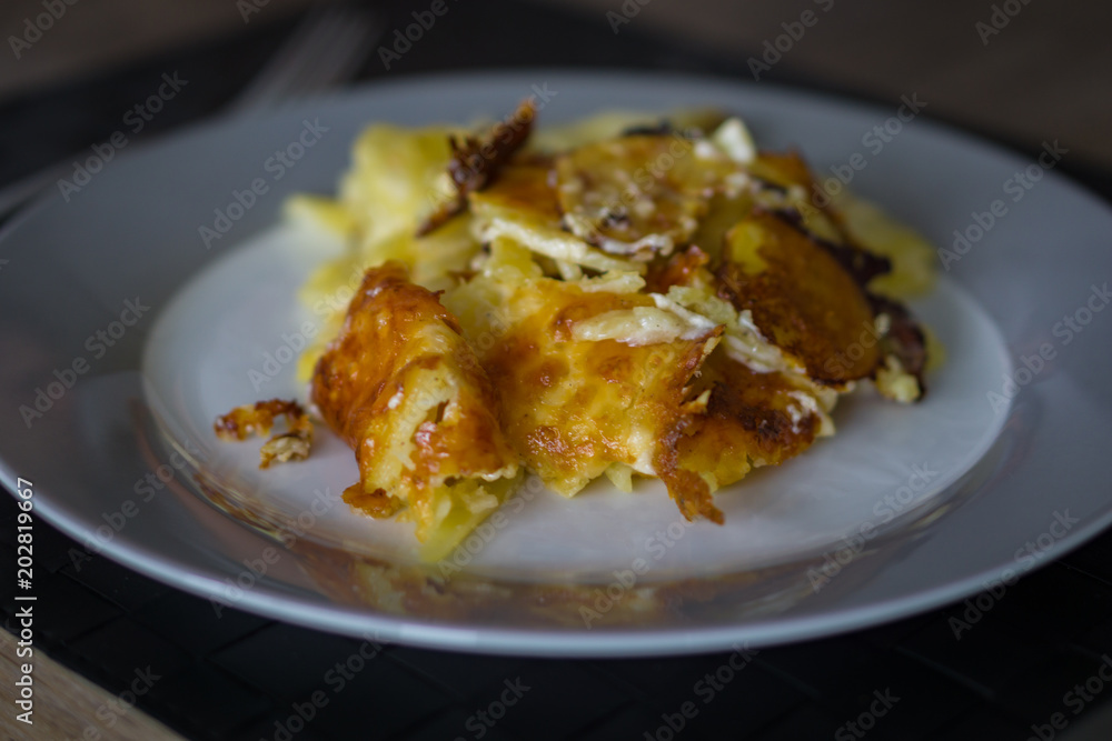 Potato casserole with cheese from the dutch oven Potato casserole with cheese from the dutch oven