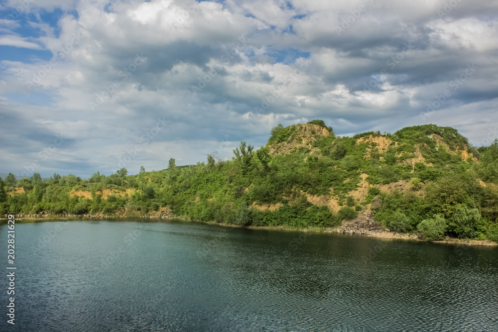 quarry nature landscape with lake and hill