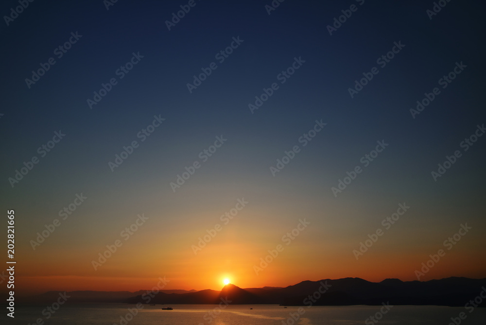 Scenic sunset on the mountain coast Scenic sunset on the mountain coast