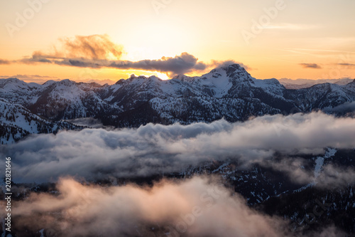 Striking and beautiful aerial landscape view of Canadian Mountains during a vibrant sunsetd. Taken North of Vancouver, British Columbia, Canada. © edb3_16