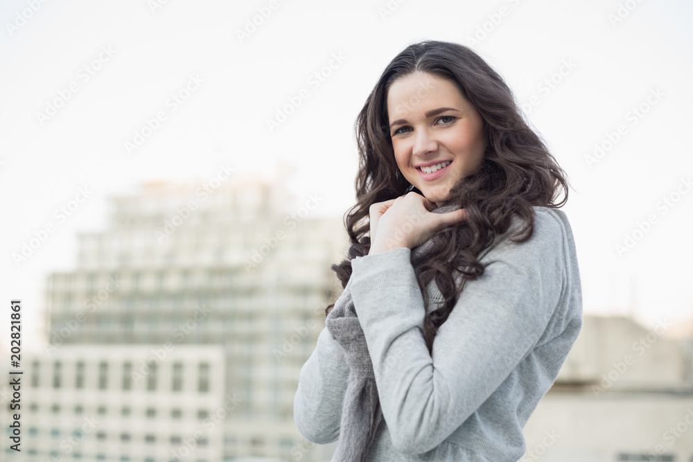 Smiling pretty brunette in winter clothes posing