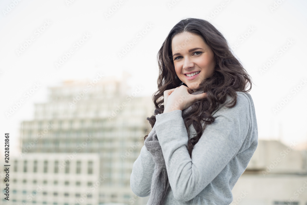Smiling pretty brunette in winter clothes posing Smiling pretty brunette in winter clothes posing