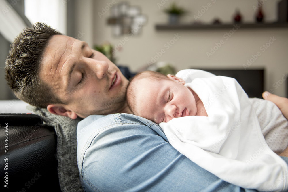Young Father Caring for his First Baby Boy Young Father Caring for his First Baby Boy