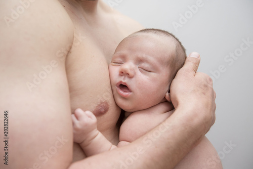 Young Father Caring for his First Baby Boy