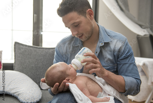 Young Father Caring for his First Baby Boy