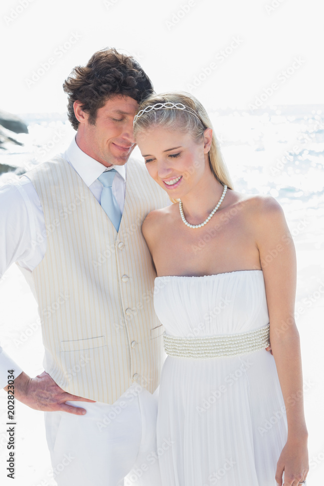 Attractive bride and groom embracing Attractive bride and groom embracing