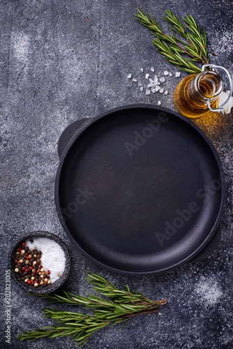 Cast iron frying pan with herbs and spices