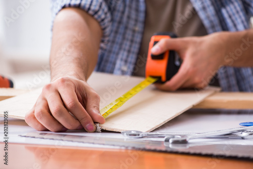 Photos Young man in woodworking hobby concept