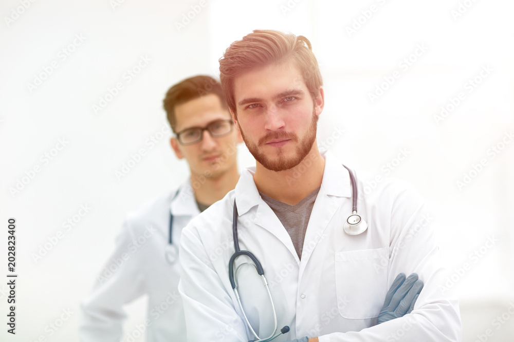 closeup. confident doctor in the background of a colleague closeup. confident doctor in the background of a colleague