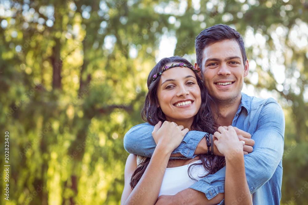 Fototapeta premium Cute couple smiling in the park