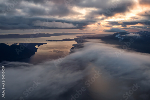 Aerial landscape view of Sunshine Coast during a vibrant and dramatic sunset. Taken Northwest of Vancouver  British Columbia  Canada.