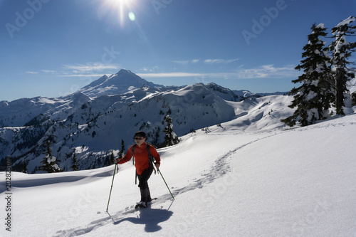 Adventurous man is snowshoeing in the alpine. Taken in Artist Point, Northeast of Seattle, Washington, United States of America.