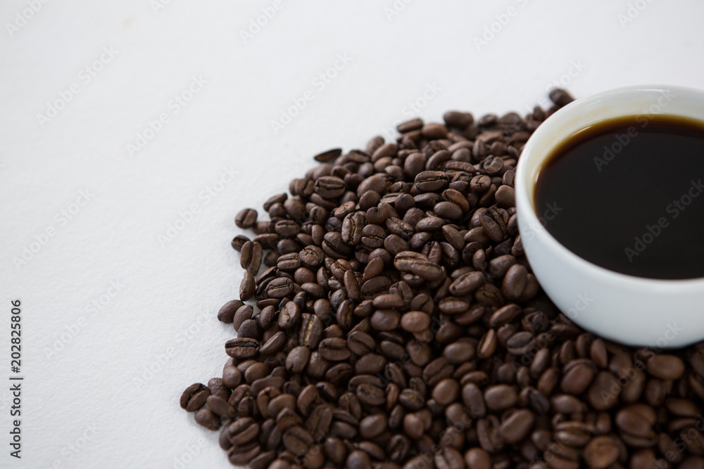 Cup of black coffee with roasted coffee beans Cup of black coffee with roasted coffee beans