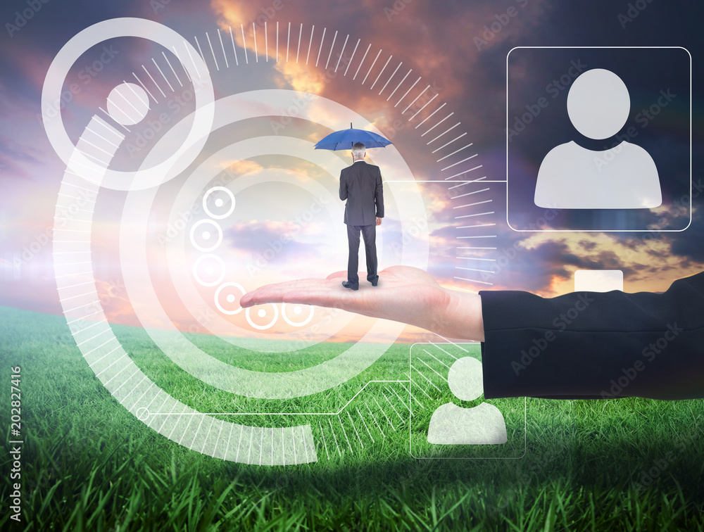 Φωτογραφία Businessman holding umbrella against green field under orange sky