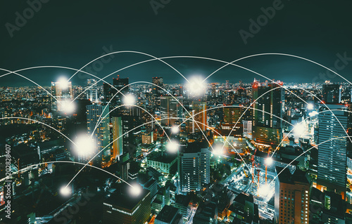 Network and connection technology concept with aerial view of Tokyo, Japan at night