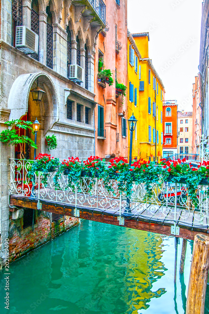 Small bridge with flowers in Venice