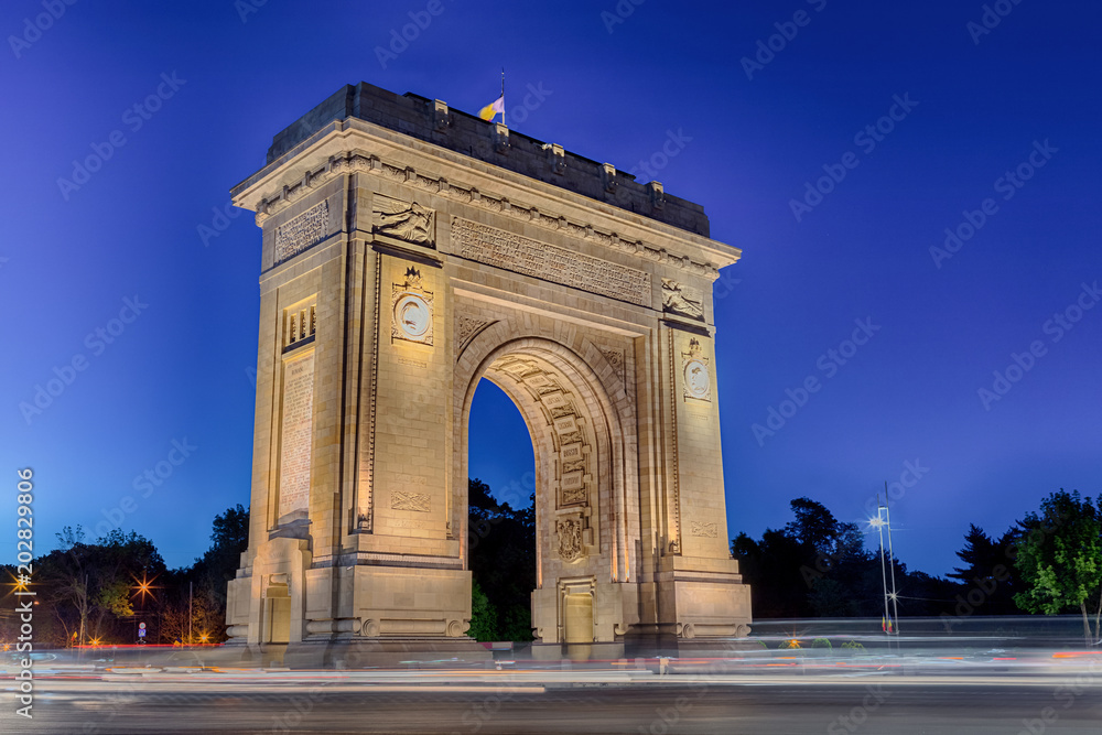 Beautiful famous Triumphal Arch historic monument at dusk in Bucharest, Romania. 